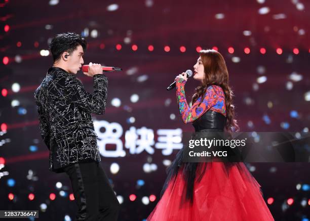 Actress Zhang Yuqi and singer Xu Weizhou perform on the stage during Jiangsu Television Gala sponsored by mobile video app Kuaishou on October 30,...