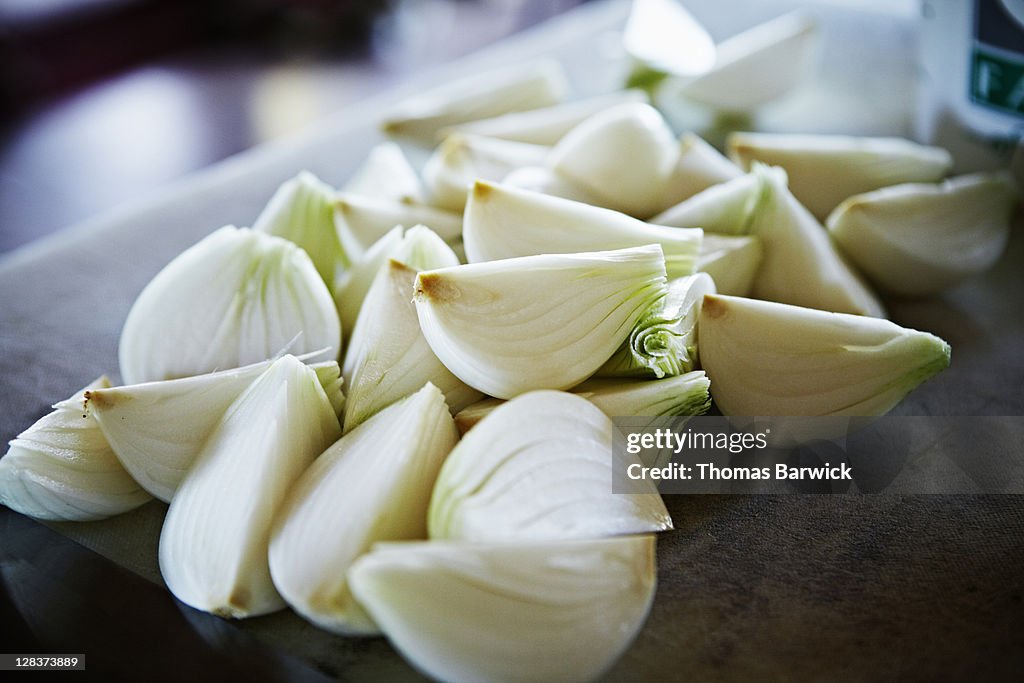 Freshly chopped onions on cutting board