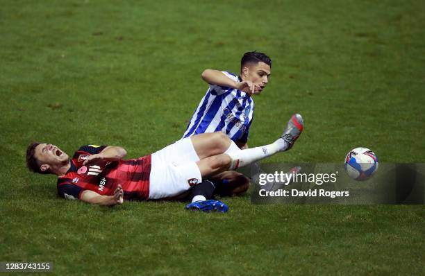 Dan Gosling of AFC Bournemouth is tackled by Joey Pelupessy of Sheffield Wednesday during the Sky Bet Championship match between Sheffield Wednesday...