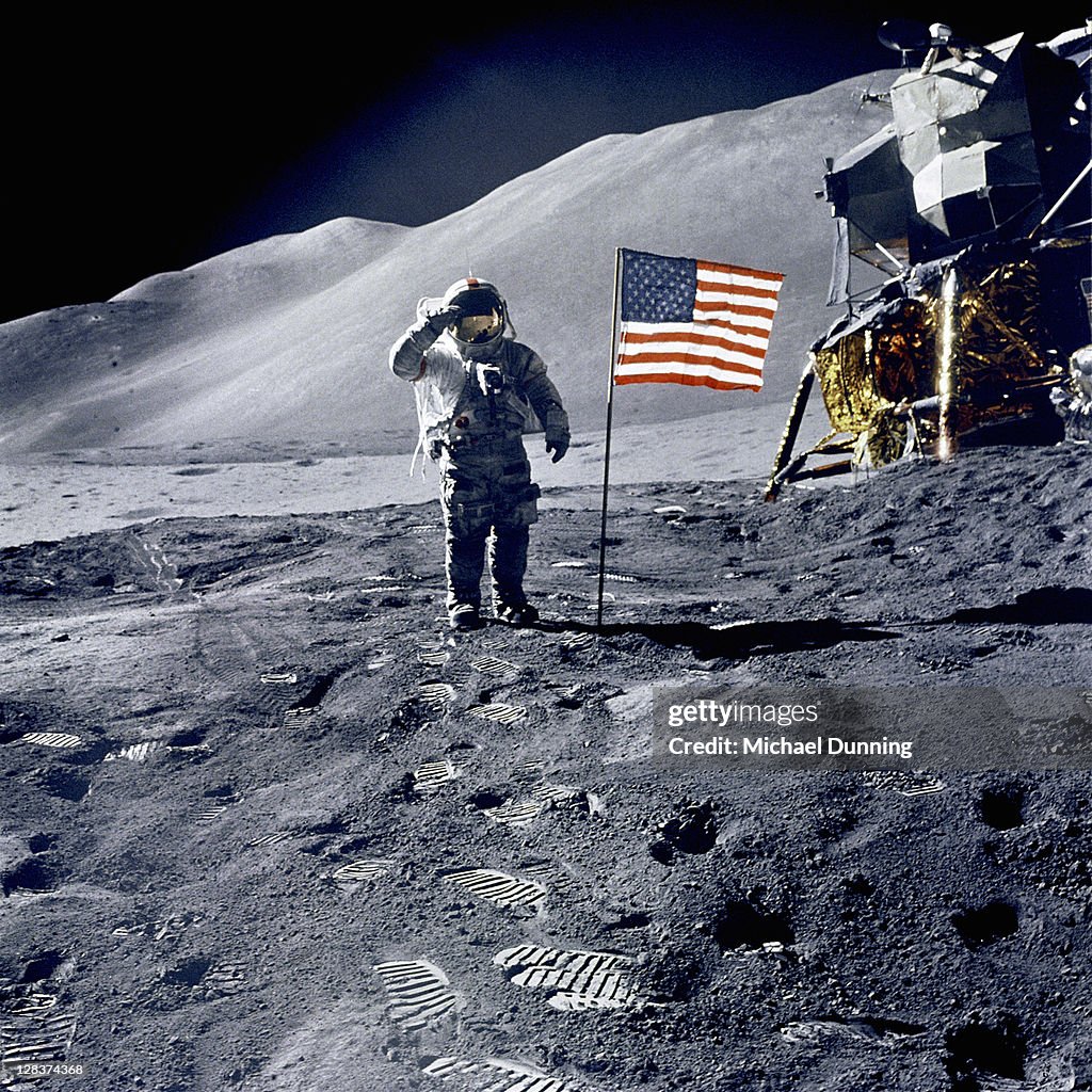 Astronaut David Scott salutes flag during Apollo 15 mission.