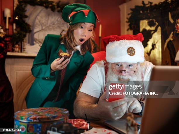 santa & elf on a video conference call - father christmas and elves stock pictures, royalty-free photos & images