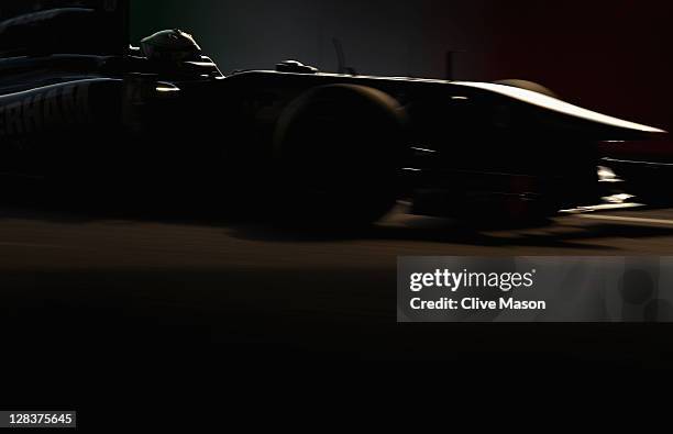 Heikki Kovalainen of Finland and Team Lotus drives during practice for the Japanese Formula One Grand Prix at Suzuka Circuit on October 7, 2011 in...