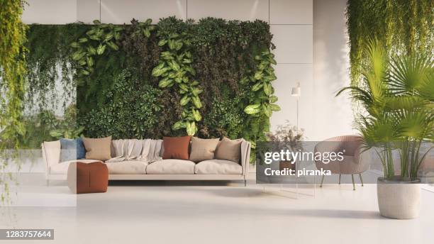 grünes wohnzimmer - vertical garden stock-fotos und bilder