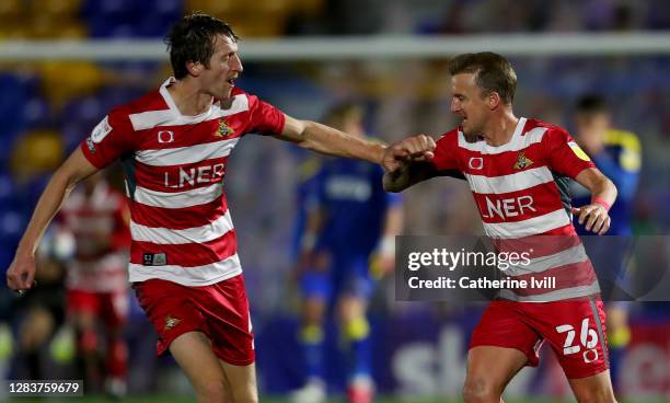 James Coppinger of Doncaster Rovers celebrates after scoring his sides second goal during the Sky Bet League One match between AFC Wimbledon and...