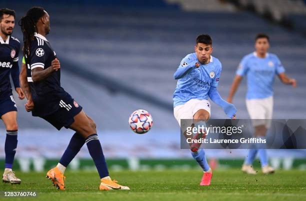 Joao Cancelo of Manchester City scores his sides third goal during the UEFA Champions League Group C stage match between Manchester City and...