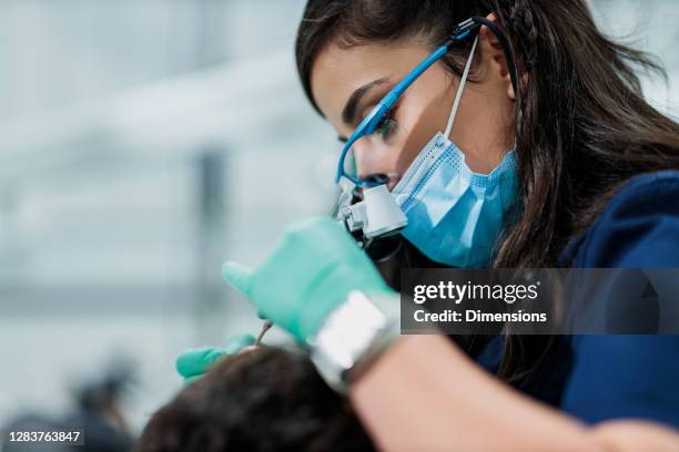 oral health is an essential part of a healthy life - dental surgery surgeon stock pictures, royalty-free photos & images