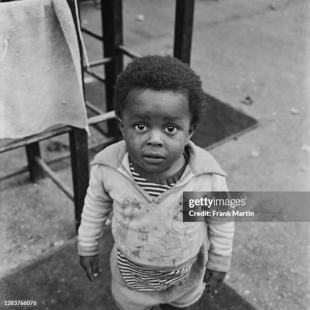 Small boy with a tear-stained face at a day nursery in the Notting Hill area of west London, circa 1958.