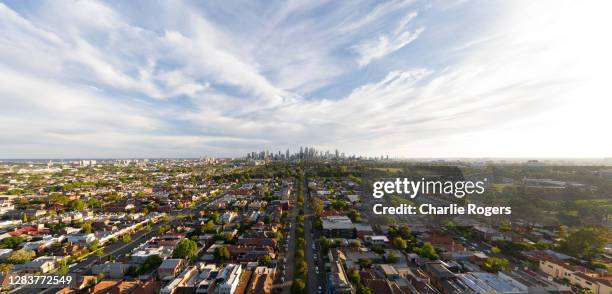 aerial of suburban melbourne and cbd at sunset - melbourne aerial view stockfoto's en -beelden