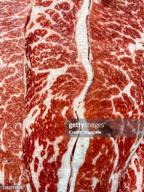 abstract pattern formed by evenly distributed fat and muscle of wagyu beef - raw food stock pictures, royalty-free photos & images