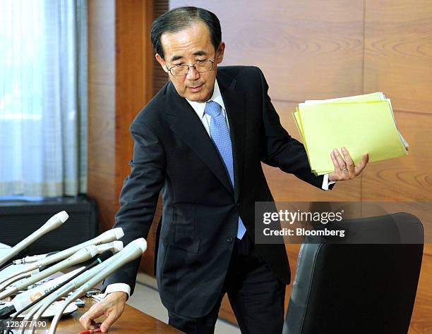 Masaaki Shirakawa, governor of the Bank of Japan, leaves a news conference in Tokyo, Japan, on Friday, Oct. 7, 2011. The Bank of Japan held off from...