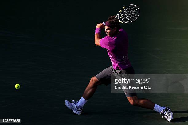 Rafael Nadal of Spain plays a backhand in his quarter final match against Santiago Giraldo of Colombia during day five of the Rakuten Open at Ariake...