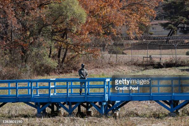 South Korean soldier stands on the Foot Bridge where North Korean leader Kim Jong Un and South Korean President Moon Jae-in took a walk together...