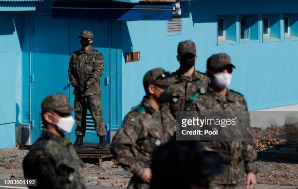 South Korean army soldiers stand guard during a reopening ceremony for border village of Panmunjom between South and North Korea in the demilitarized...