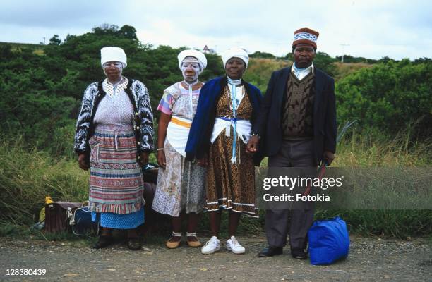 xhosa man and three woman standing at side of road - xhosa culture stock pictures, royalty-free photos & images