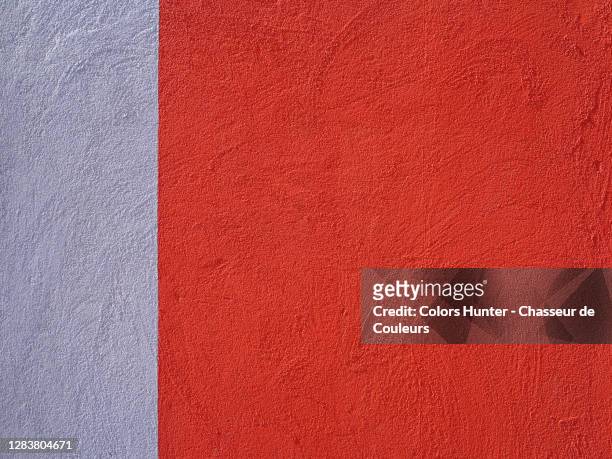 concrete wall painted in red and gray with rough texture in porto - red wall stockfoto's en -beelden