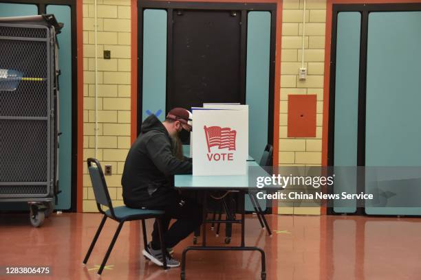 Voter casts ballot at a polling station for the 2020 U.S. Presidential election on November 3, 2020 in Washington, DC.