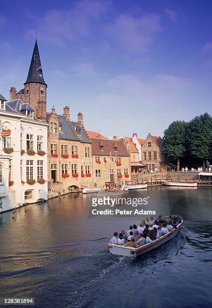 canal boat tour, bruges, belgium - bruges brugge stock pictures, royalty-free photos & images