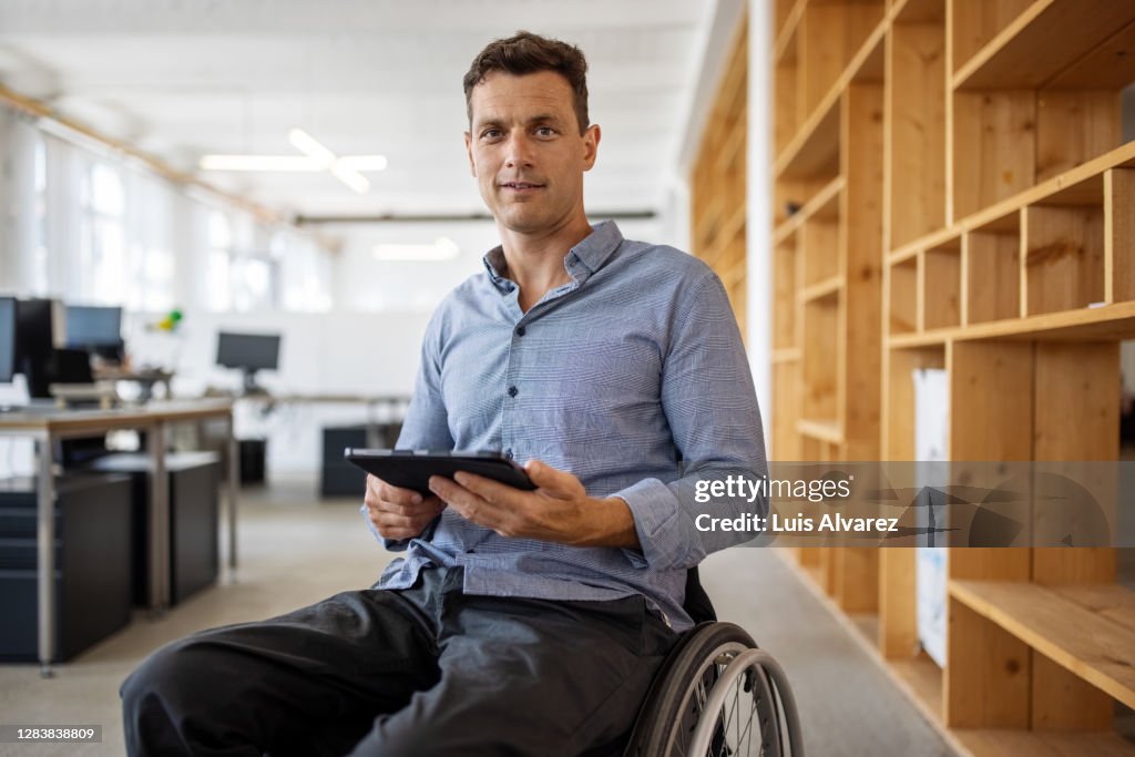 Portrait of an entrepreneur sitting on wheelchair