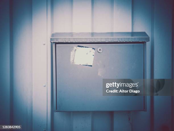 mailbox fixed on a metal frame. retro image. germany. - post game stock-fotos und bilder