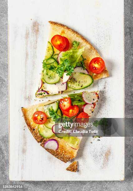 slices of vegetarian and gluten-free pizza on white background - vegetable pizza stock pictures, royalty-free photos & images