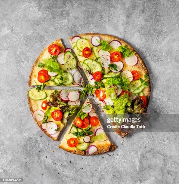vegetarian and gluten-free pizza on gray background - vegetarian pizza stock pictures, royalty-free photos & images