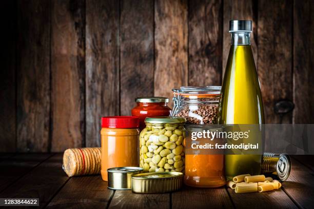 non perishable food on rustic wooden table. copy space - não perecíveis imagens e fotografias de stock