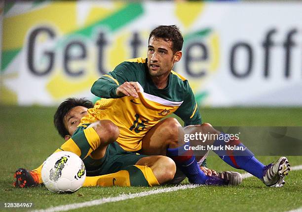 Carl Valeri of the Socceroos makes a tackle during the International Friendly match between the Australian Socceroos and Malaysia at Canberra Stadium...