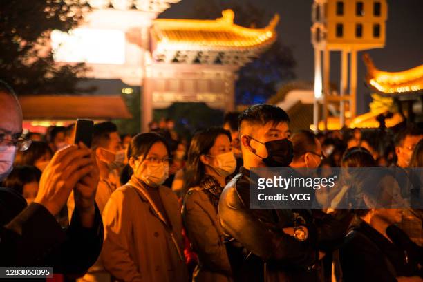 Members of the Wuhan Philharmonic Orchestra perform during a concert at the Yellow Crane Tower Park on November 3, 2020 in Wuhan, Hubei Province of...