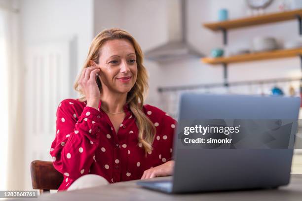 mature woman working from home - top 40 single stock pictures, royalty-free photos & images