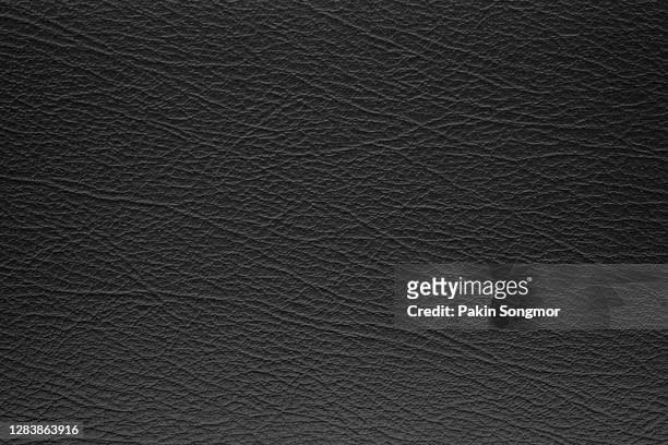 close up black leather and texture background. - black leather texture stock-fotos und bilder