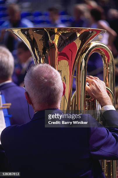 man playing tuba in orchestra - tube foto e immagini stock