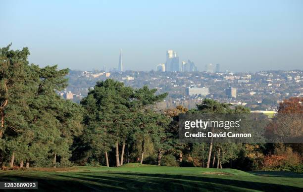 View from the tee of the green on the short par 4, 14th hole with the city of London skyline in the distance at The Addington Golf Club on November...