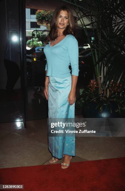 American model and actress Kathy Ireland, wearing a blue skirt and blue long-sleeved top, attends the 2nd Annual Family Television Awards, held at...