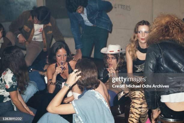 American singer-songwriter and actor David Johansen of American rock band New York Dolls surrounded by female fans backstage at the Whisky a Go Go, a...