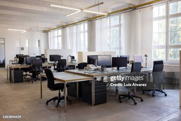 open plan startup office space - sparse desk stock pictures, royalty-free photos & images