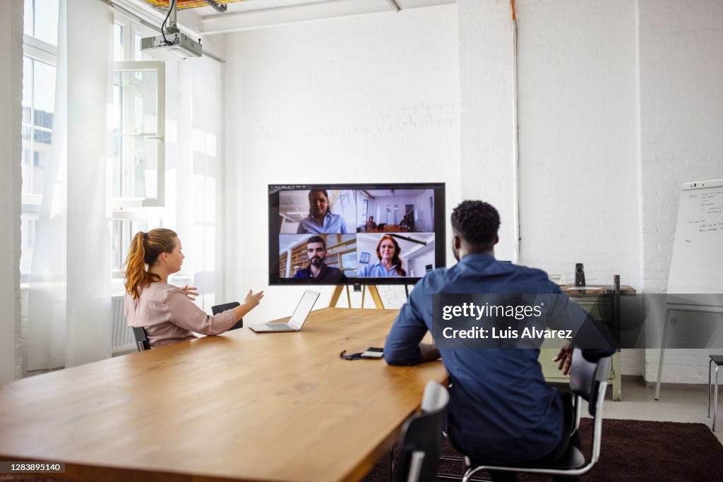 Businesspeople having a video conference in office