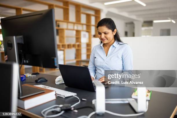 woman at ergonomic desk having a teleconference - german designed stock pictures, royalty-free photos & images