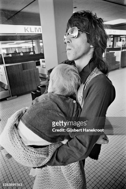 Keith Richards of The Rolling Stones holding his son Marlon at Schiphol Airport, Netherlands, returning home after the last date of The Rolling...