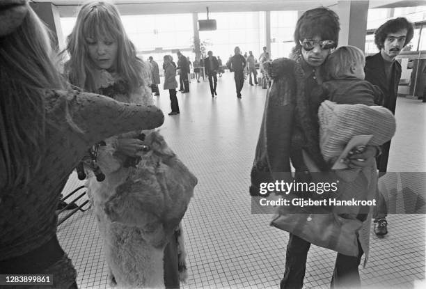 Anita Pallenberg with Keith Richards of The Rolling Stones holding their son Marlon at Schiphol Airport, Netherlands, returning home after the last...