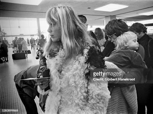 Anita Pallenberg with Keith Richards of The Rolling Stones holding their son Marlon at Schiphol Airport, Netherlands, returning home after the last...