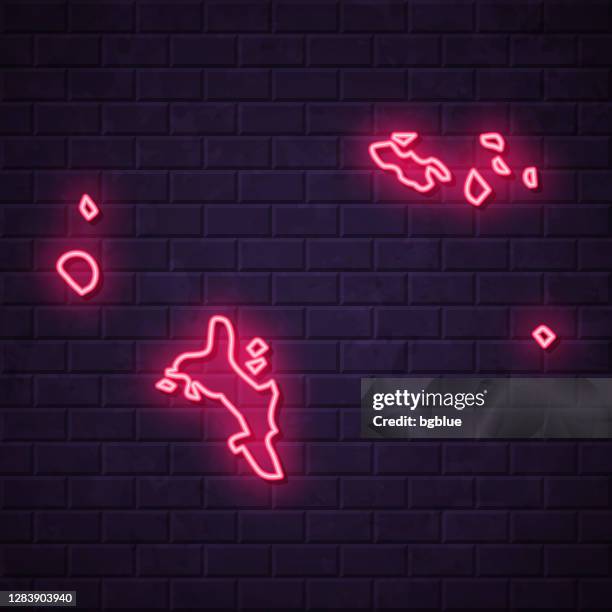 seychelles map - glowing neon sign on brick wall background - seychelles stock illustrations