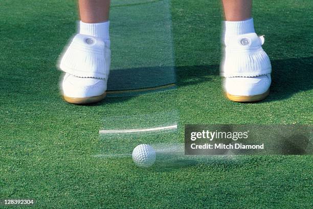 golf club in motion over golf ball - golf swing close up stock pictures, royalty-free photos & images