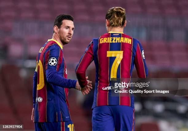 Lionel Messi of FC Barcelona celebrates after scoring his team's first goal with his teammate Antoine Griezmann during the UEFA Champions League...