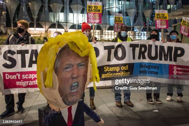 Demonstrators from 'Stand Up To Racism' hold a protest outside the US Embassy in Vauxhall, demanding that Donald Trump concedes defeat and leaves...