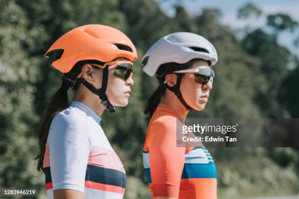 2 Asian chinese women road bike cyclist portrait