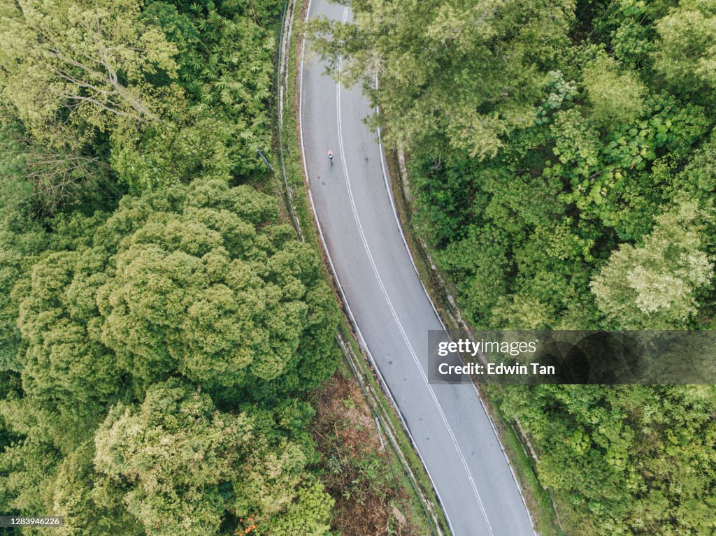 Bike ride road trip at rural area ulu langat with 2 sportswoman athlete rider in the morning drone view