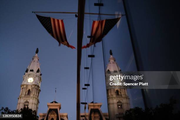 The American flag hangs from a building near Philadelphia City Hall on November 04, 2020 in Philadelphia, Pennsylvania. With no winner declared in...