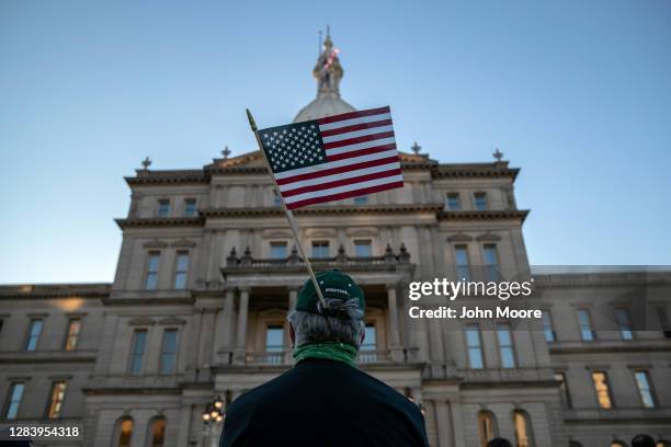 Protesters attend a "Count On Us" rally at the Michigan State Capitol building on November 04, 2020 in Lansing, Michigan. People gathered to demand...