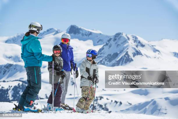 family on ski vacation in whistler, bc, canada. - family skiing stock pictures, royalty-free photos & images