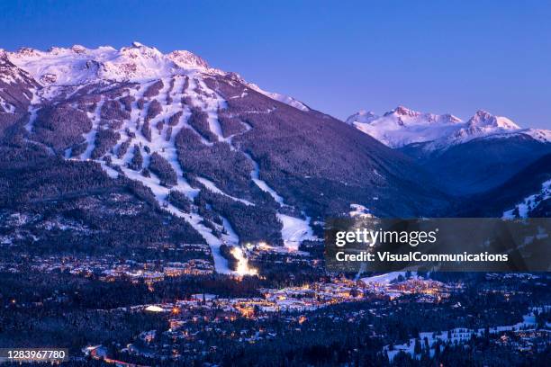 scenic of whistler blackcomb ski resort at dusk. - british columbia winter stock pictures, royalty-free photos & images